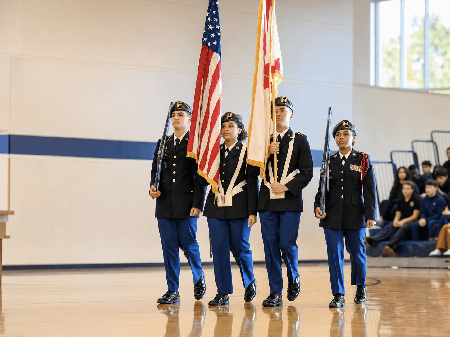 Army JROTC cadets marching in a color guard
